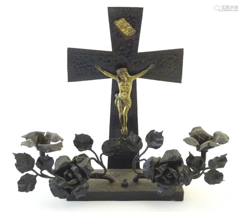 A 20thC crucifix candelabra with Christ on t…