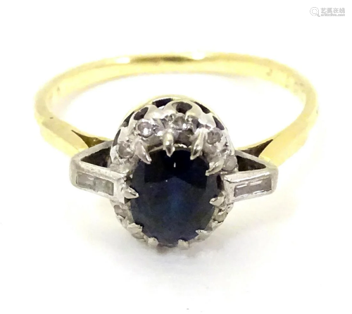 An 18ct gold ring set with central sapphire border…