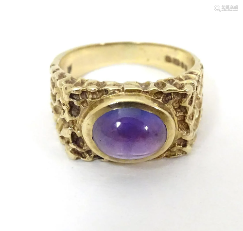 A 9ct gold retro ring set with central amethyst