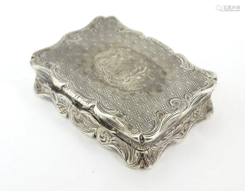 A Victorian silver vinaigrette with engraved and