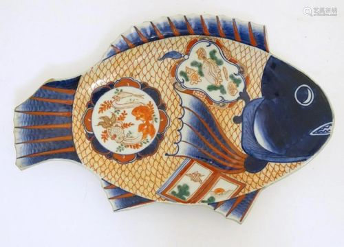 An Imari dish formed as a fish, decorated with panels