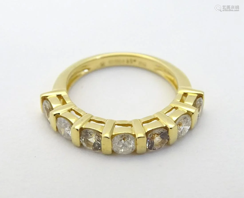 An 18ct gold ring set with diamonds and yellow sto…