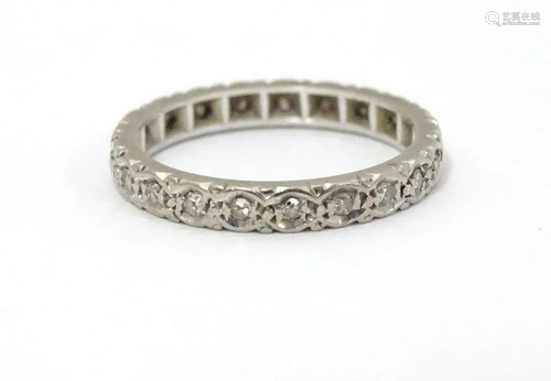 A white gold eternity ring set with band of diamo…