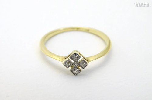 An 18ct gold ring set with four diamonds