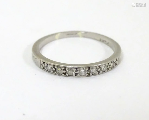 A platinum half eternity ring set with 7 diamonds