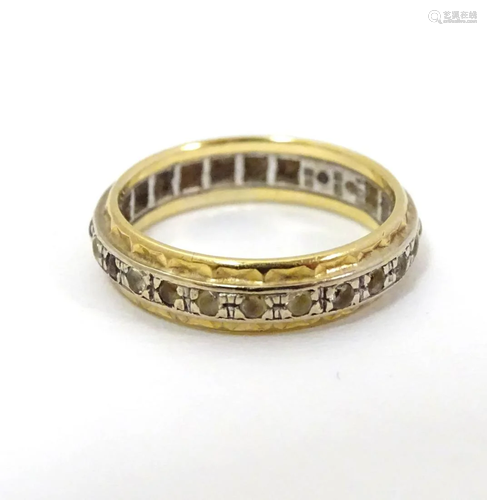 An 18ct yellow and white gold eternity ring set …