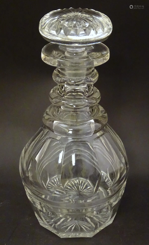 A 19thC cut glass three ring decanter and stopper.