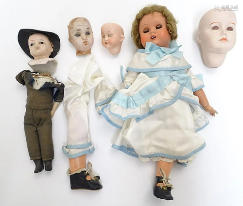 Toys: A 20thC doll with a painted bisque socket head,