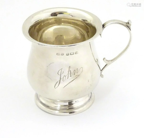 A silver Christening mug hallmarked Birmingham 1933