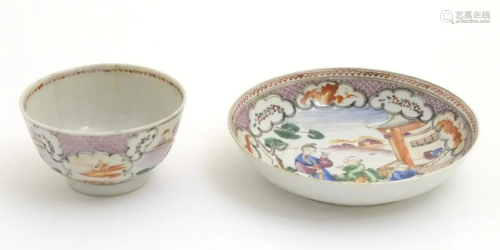 A Chinese famille rose tea bowl and saucer with hand