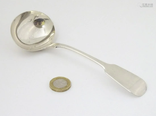 A Victorian silver fiddle pattern sauce ladle