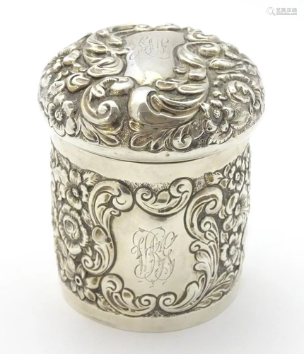 A silver pot of cylindrical form with domed …