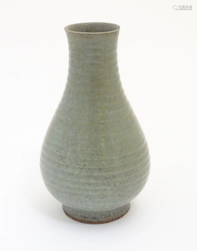 A Chinese celadon pear-shaped vase with a crackle