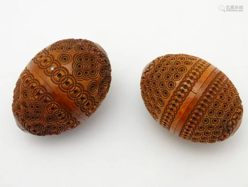 Two carved coquilla nut egg shape containers decorat…