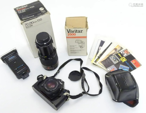 A late-20thC Nikon 'EM' SLR 35mm film camera, toget…