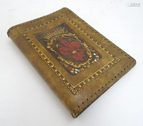 An Italian embossed and tooled leather book cover,