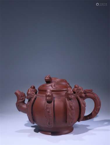 An Ancient Chinese Zisha Teapot Carved with the Pattern of Nine Sons of the Dragon