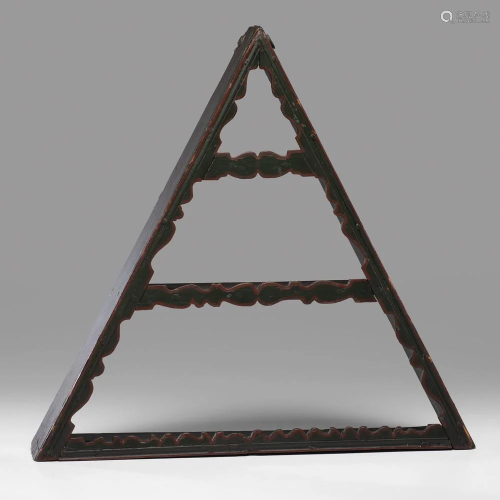 A Carved and Painted Pine Triangular Hanging Shelf