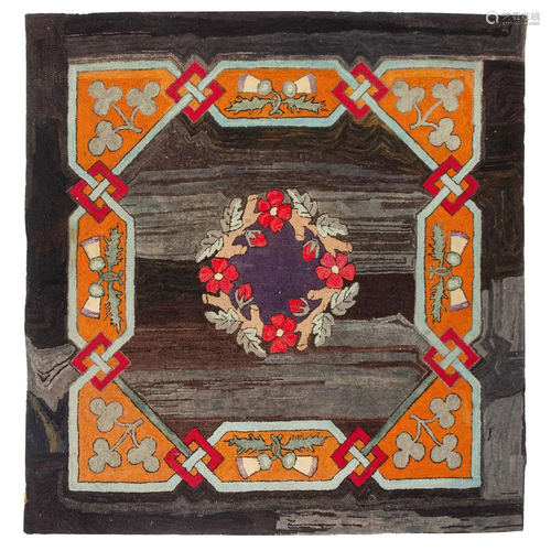 A Floral Wreath Decorated Hooked Rug