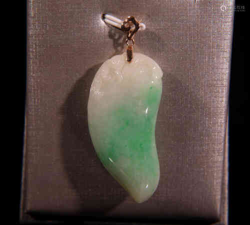 A Chinese Carved Jadeite Melon-shaped Pendant.