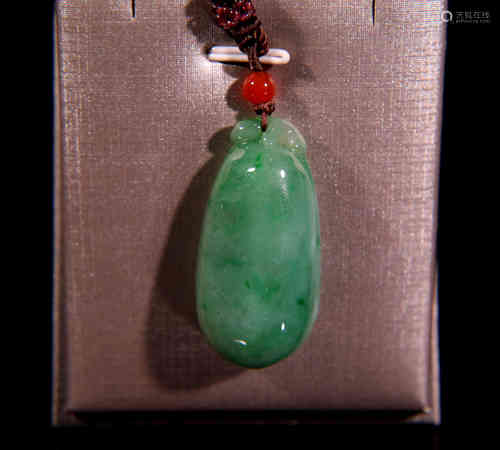 A Chinese Jadeite Melon-shaped Pendant.