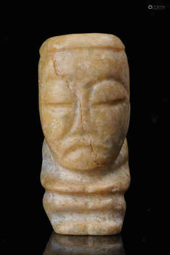 A Carved Jade Figure.