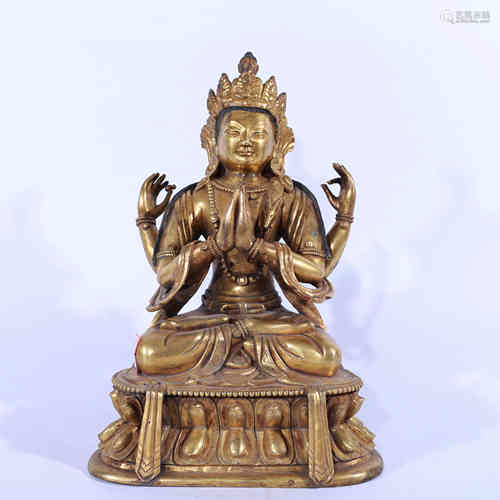 A Bronze Statue of Four-armed Guanyin.