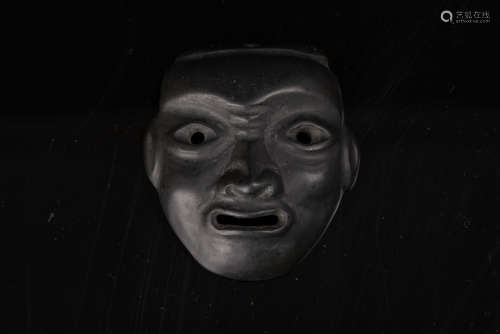 A Chinese Blackstone Mask.