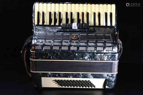 A Vintage Wood Accordion.