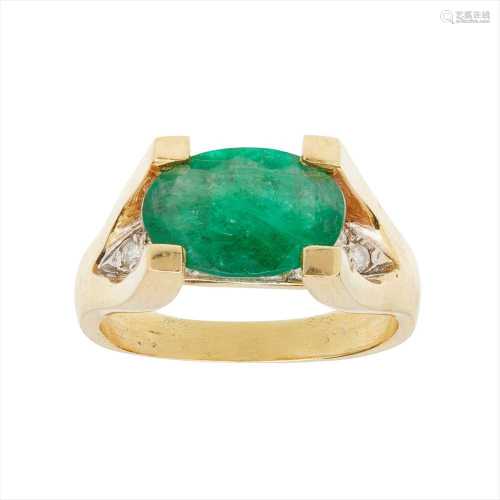 An emerald and diamond set ring