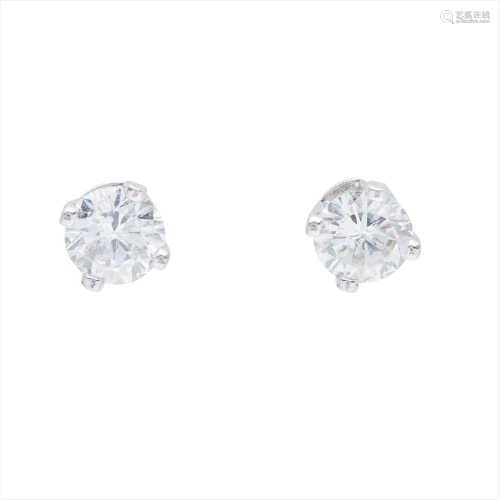 A pair of diamond set ear studs