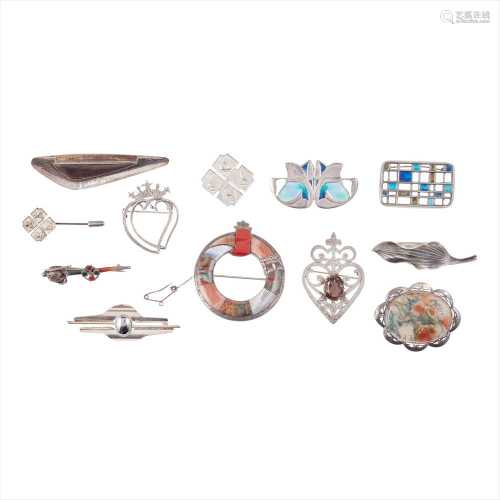A collection of various brooches