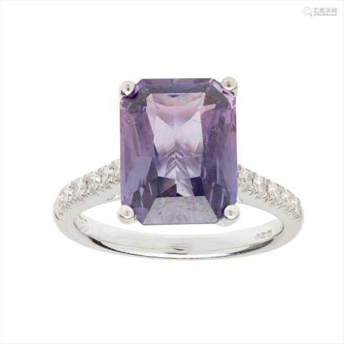 A purple sapphire and diamond set ring