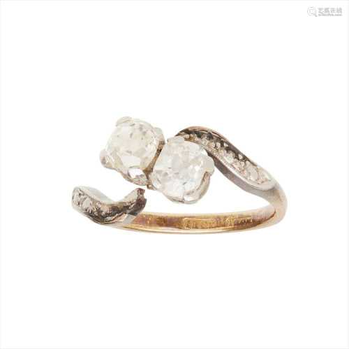 A two stone diamond set twist ring