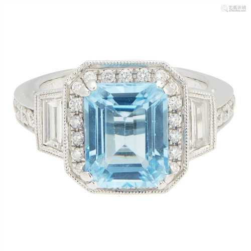 A blue topaz and diamond set ring