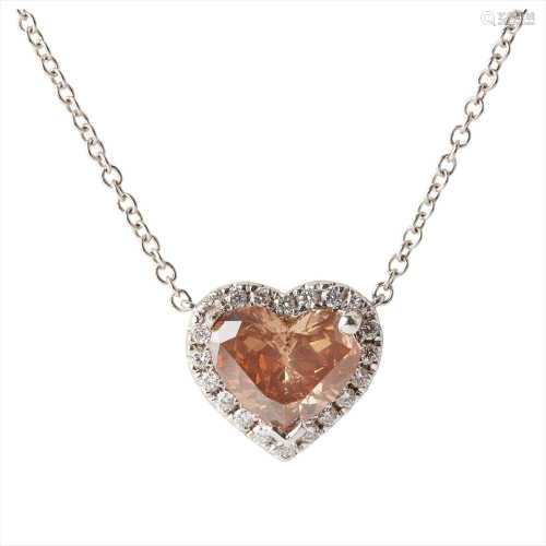 A fancy brown and colourless heart shaped diamond pendant