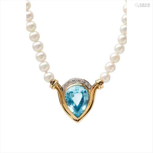A pearl and topaz set necklace