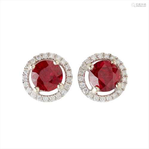 A pair of ruby and diamond set cluster earrings