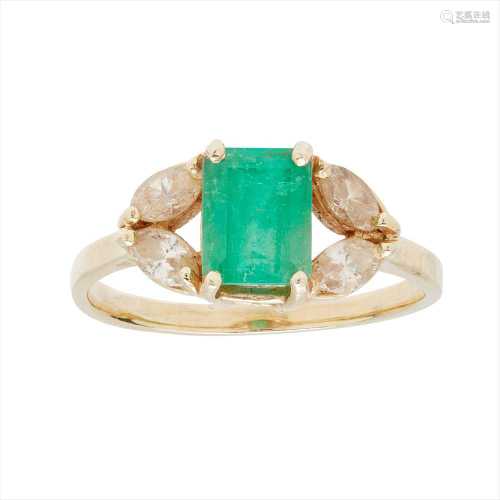 An emerald and diamond set ring