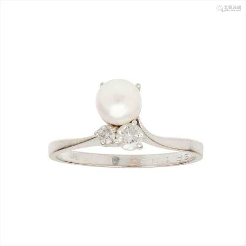A pearl and diamond set ring
