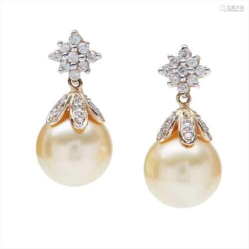 A pair of pearl and diamond set earrings