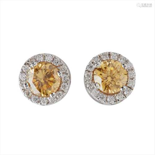 A pair of yellow and colourless diamond set cluster earrings