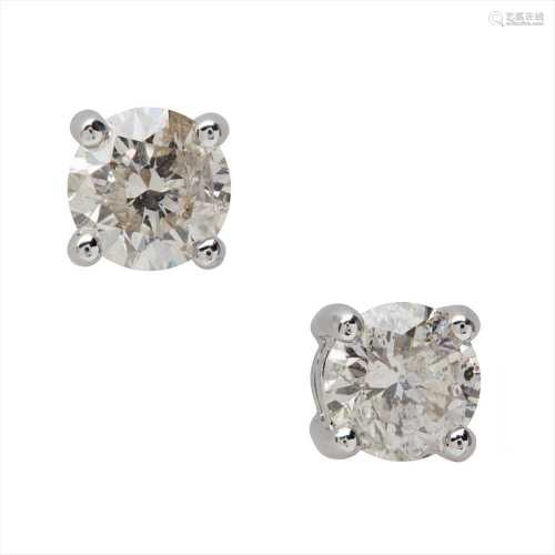 A pair of diamond set stud earrings