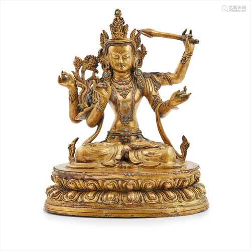 GILT-BRONZE FIGURE OF FOUR-ARMED MANJUSRI 19TH-20TH CENTURY