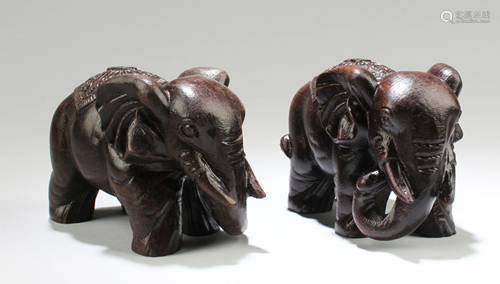 A Pair of Chinese Hardwood Carved Elephant St…