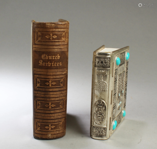 A Group of Two Books with Copper Book Cover with