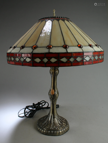 A Table Lamp With Frosted Glass Shade