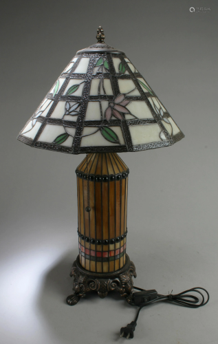 A Table Lamp With Frosted Glass Shade