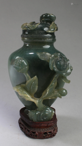 A Carved Jade Vase With Wood Stand