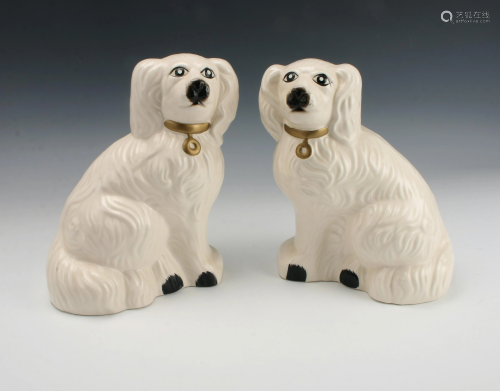 PAIR OF WHITE STAFFORDSHIRE STYLE DOGS